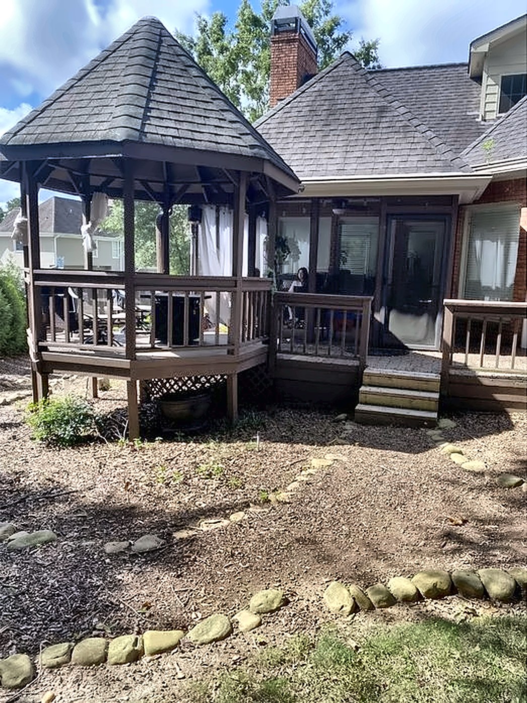 Before: old stained deck and gazebo