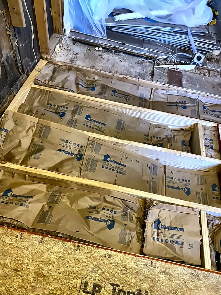 New floor joists with insulation installed